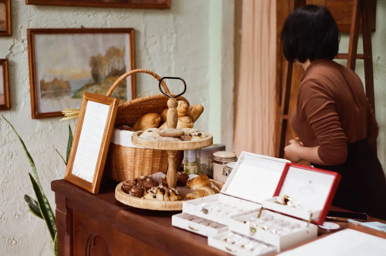 Warm café table with speciality coffee and fresh pastry
