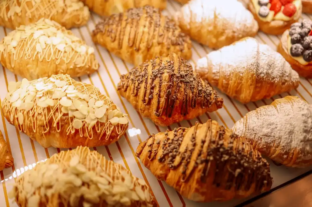 Toasted almond croissants dusted with powdered sugar