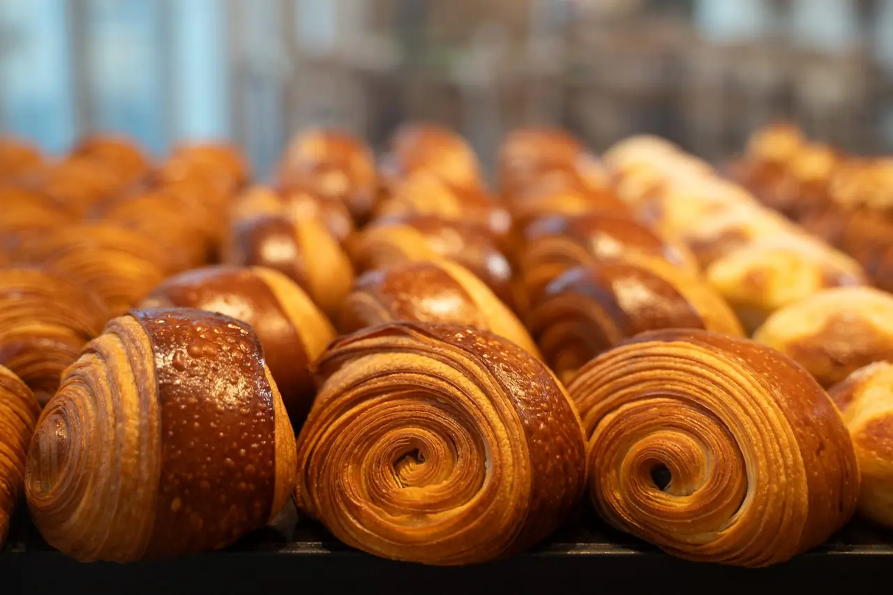 Fresh artisan chocolate croissants with crisp laminated pastry
