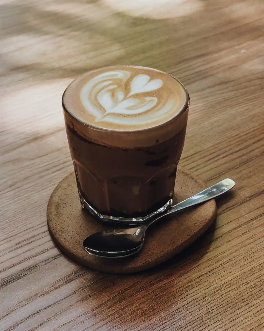 Hand-poured speciality flat white coffee with fine foam art