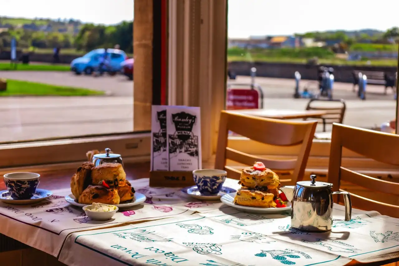 Traditional British afternoon tea with scones and fine tea settings